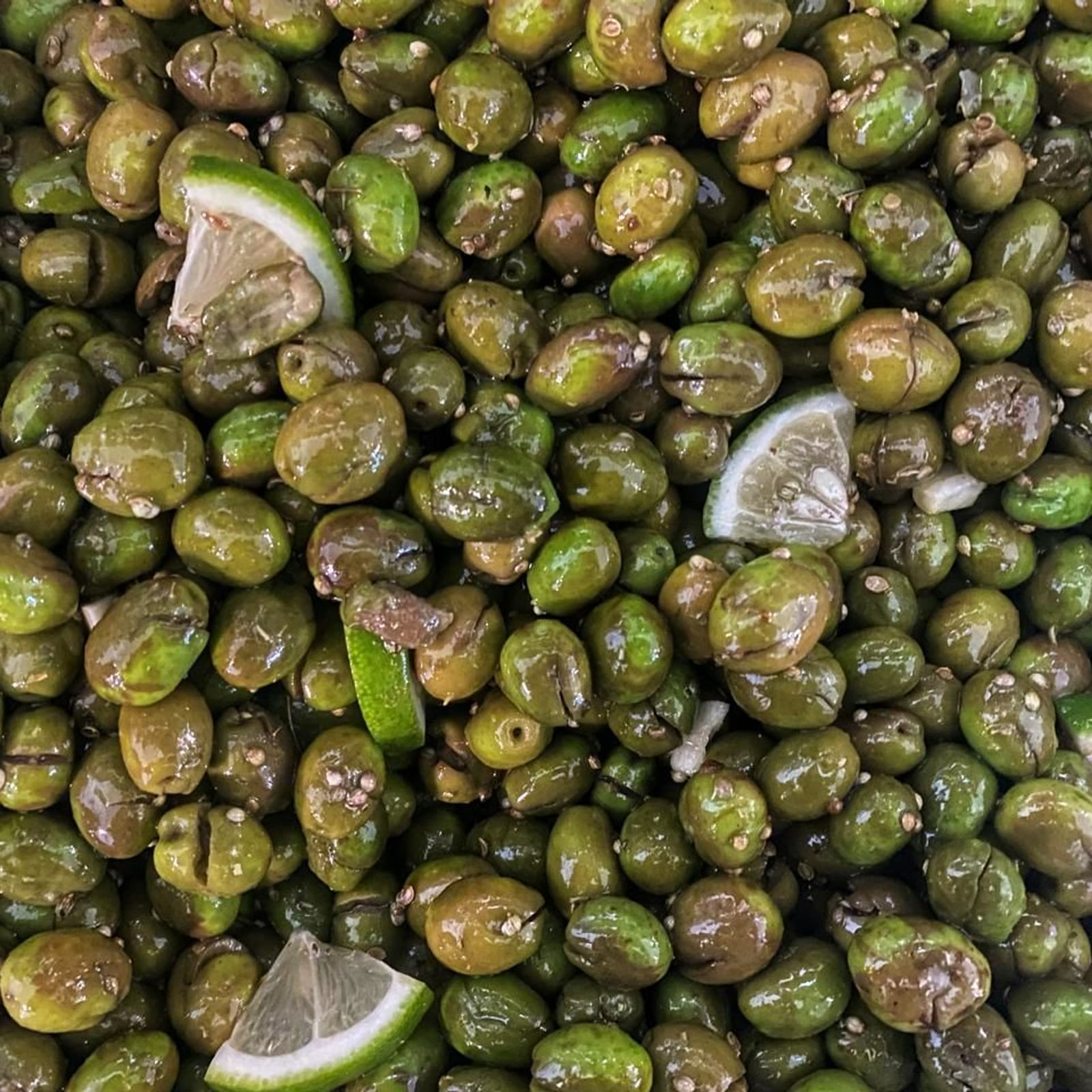 Tsakistes — green olives cracked in-house, with lemon and coriander.